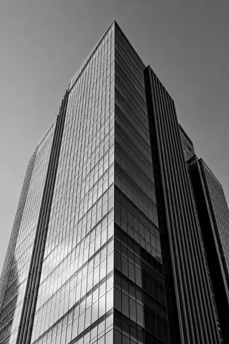 Black-and-white view of a modern commercial building with strong geometric lines